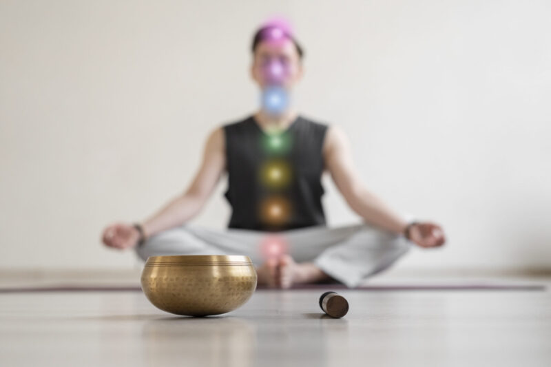 spiritual-young-man-practicing-yoga-indoors